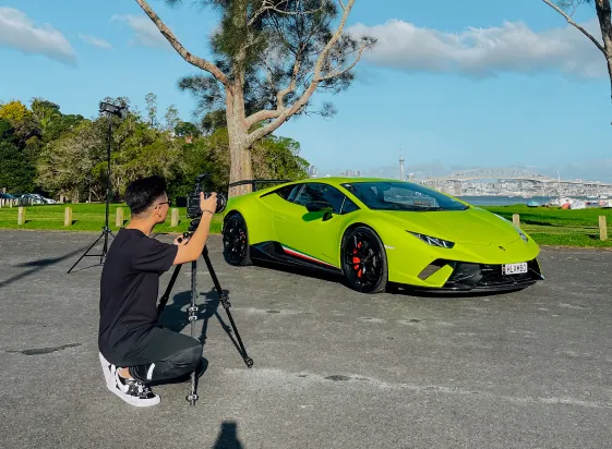 Photographer shooting a green Lamborghini
